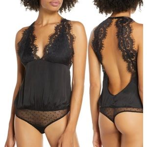 Free People Melrose bodysuit in black.